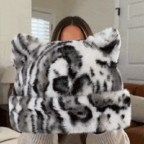 Plush cat ear hat being worn